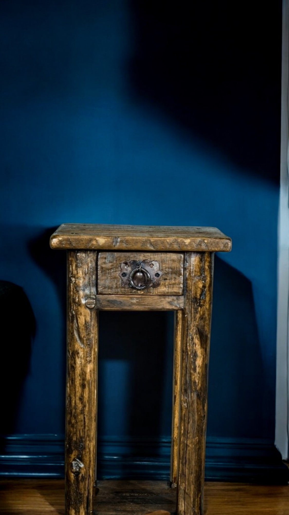 Rustic wooden side table with a drawer