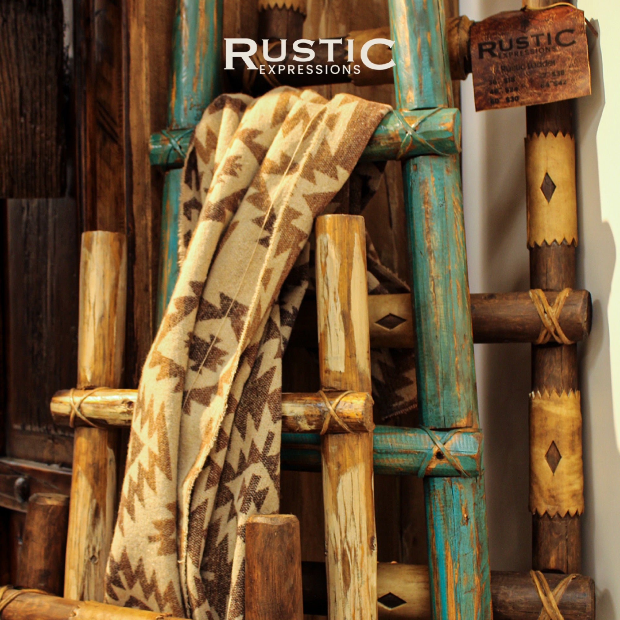 Rustic wooden ladders with patterned fabric draped over them