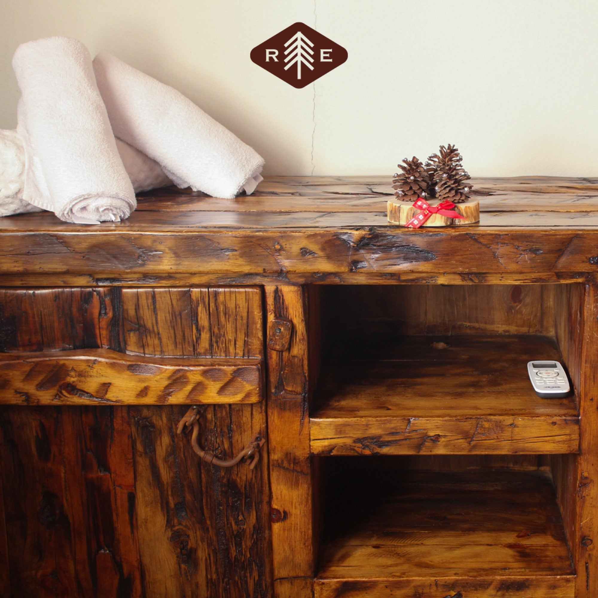 Rustic wooden cabinet with rolled towels